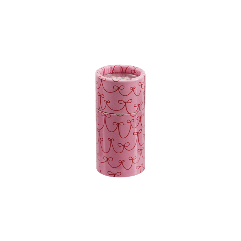 Pink tube matchbox with a red bow pattern containing safety matches.