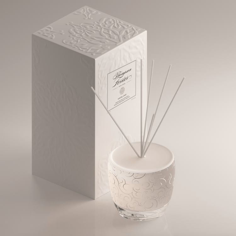 Santal Cave reed diffuser bottle with natural wood sticks in a neutral-toned glass container.