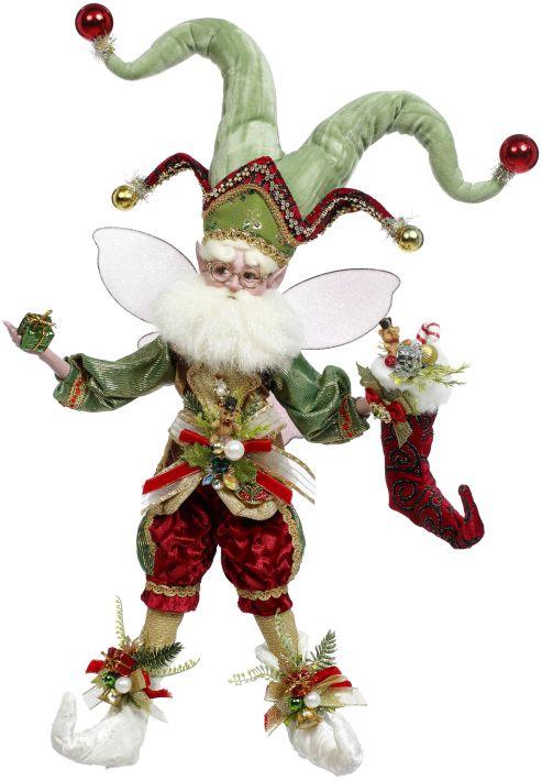 Resin fairy figurine with stocking maker wings in pastel pink and white tones.