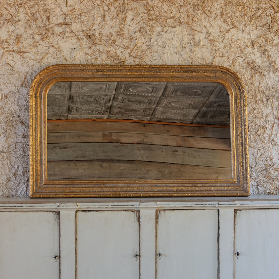 Horizontal aged gold metal mirror with wood backing