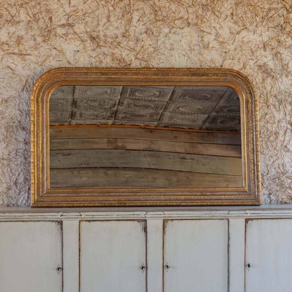 Horizontal aged gold metal mirror with wood backing