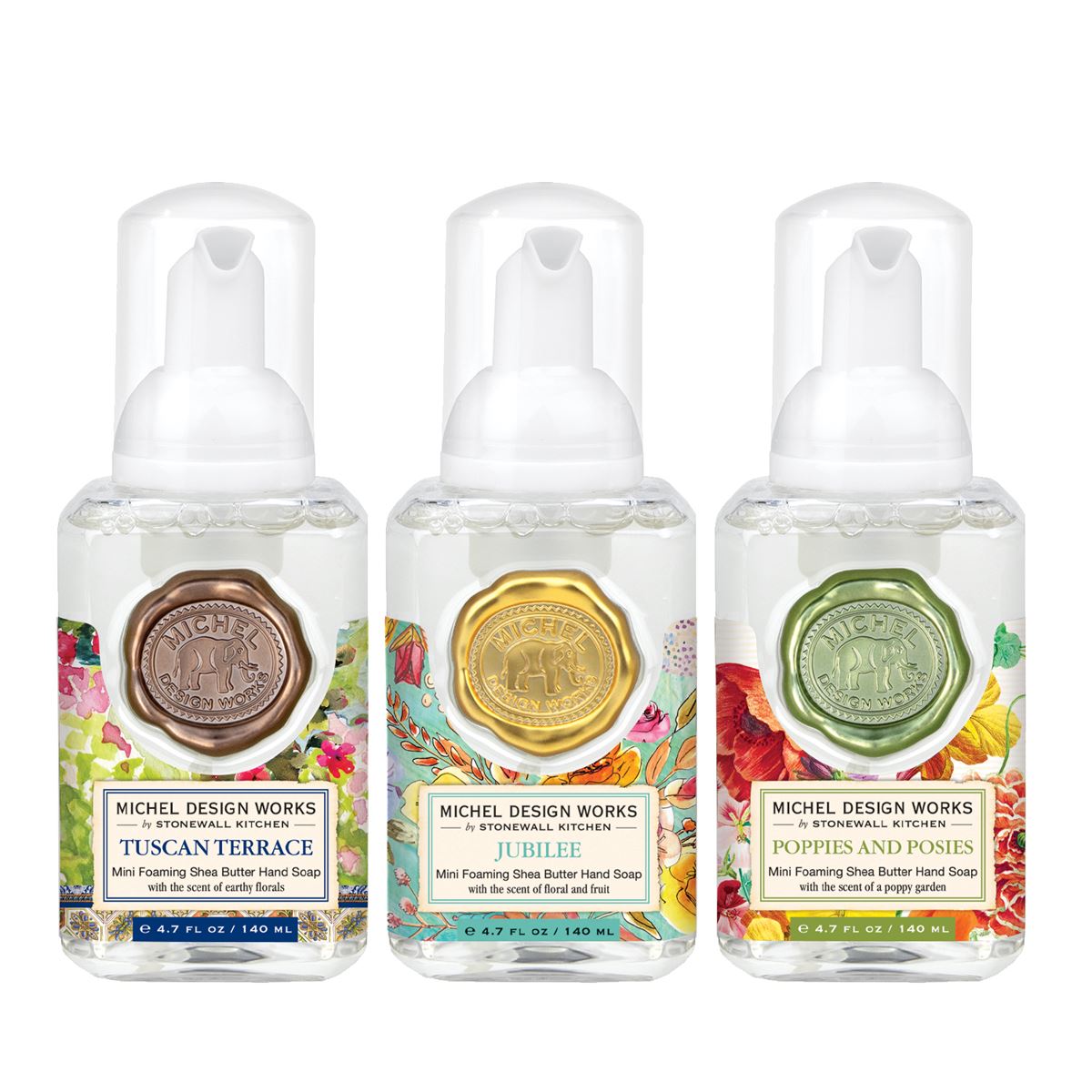 Set of three mini foaming soap dispensers in assorted complementary scents and designs.