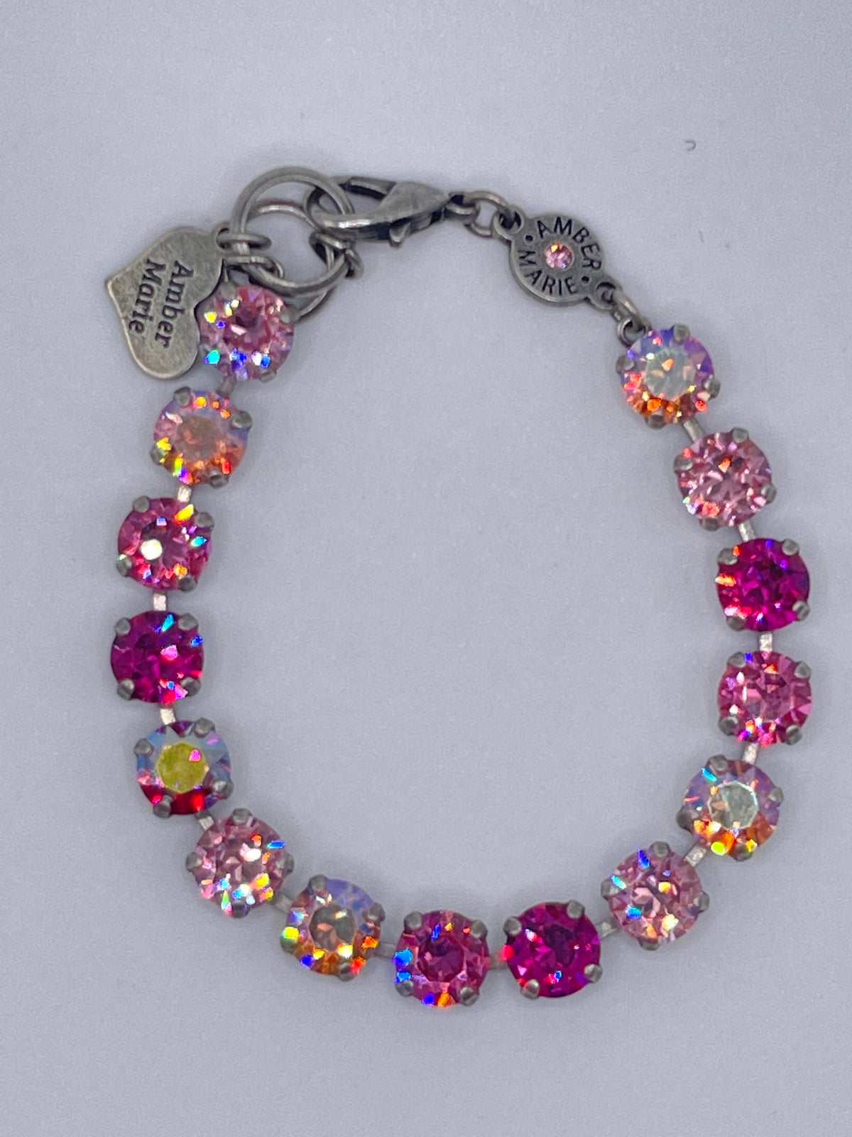 Amber Marie bracelet featuring pink and iridescent round crystals in a silver-tone setting.