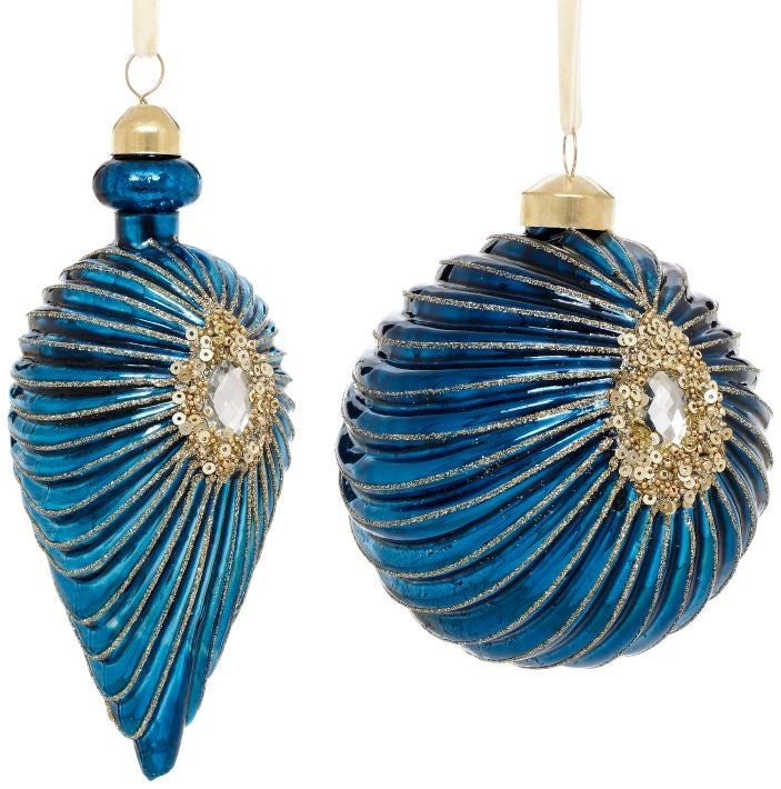 Two blue glass Jeweled Starburst Ornaments with gold swirling details and crystal centerpieces.