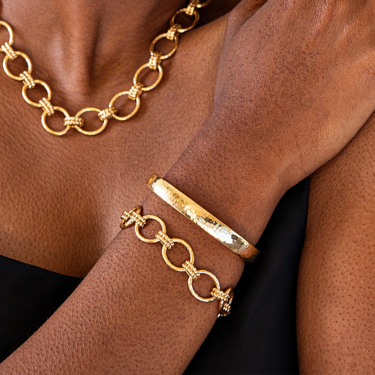 Gold oval hinged bangle bracelet with anti-tarnish coating