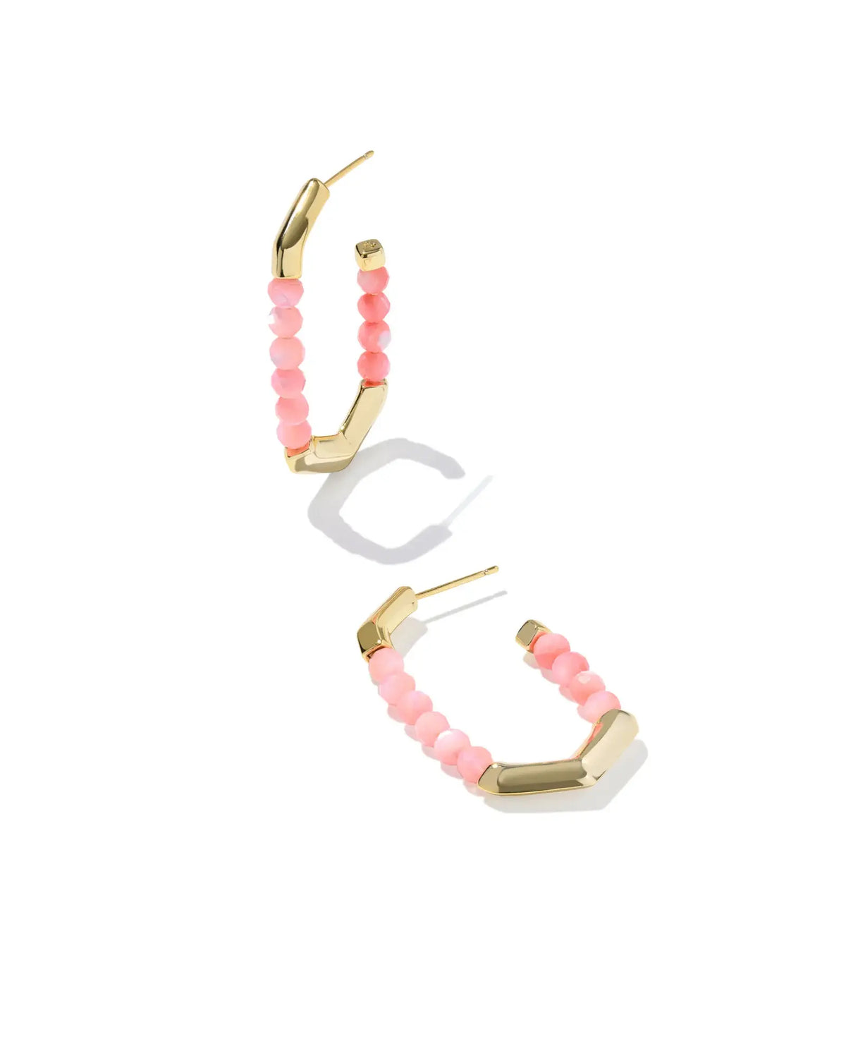 Gold Sylvia hoop earrings featuring pink chalcedony stones with a textured finish.