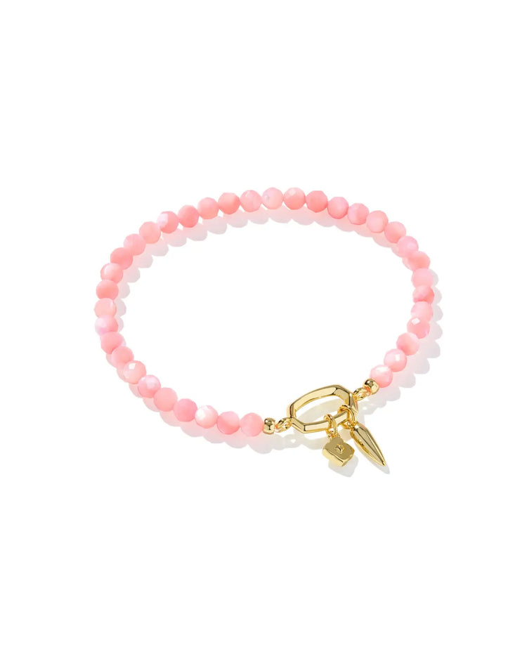 Stretch bracelet in gold with pink chalcedony stones featuring a toggle closure.