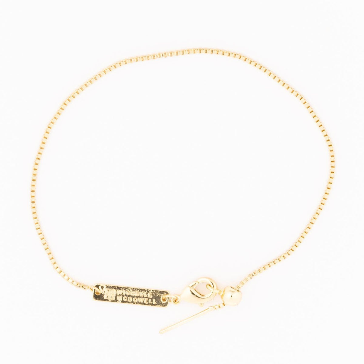 Gold Sylvie bracelet featuring a delicate chain with small sparkling gemstone accents.