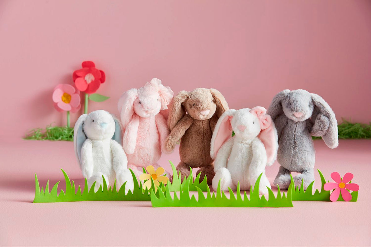 Mini Bunny plush toy in white with black ears measuring 5-3/4 inches tall.
