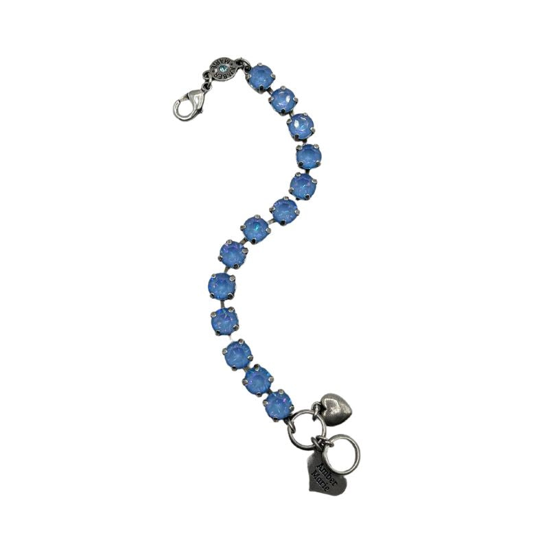 Classic Santorini bracelet featuring blue ombre stones, amber tag with crystal, and Scotty dog heart charm.