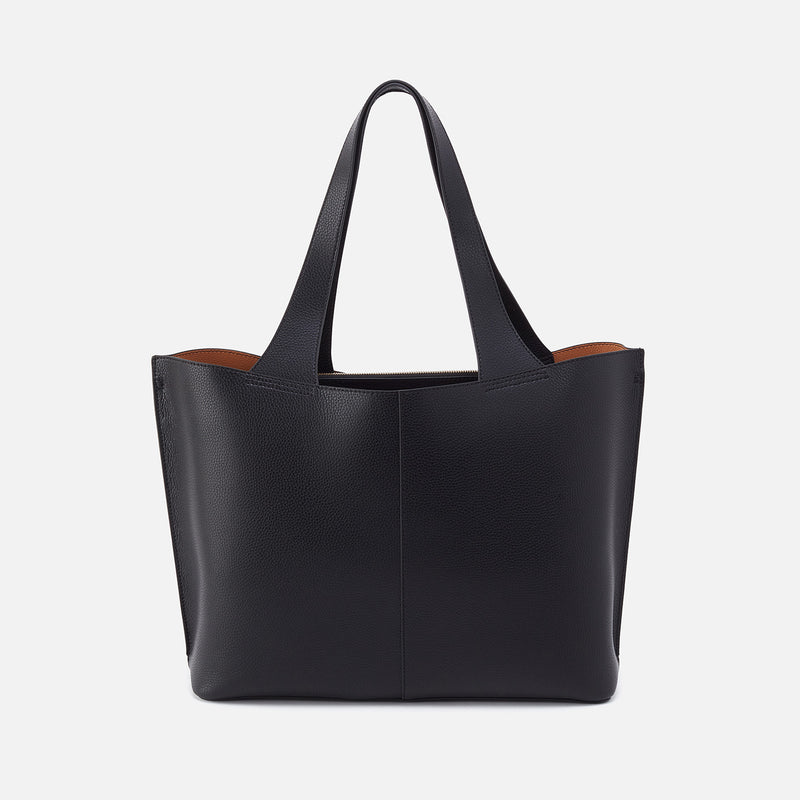 Vida large tote in brushed antique brass hardware with coconut shell interior lining.