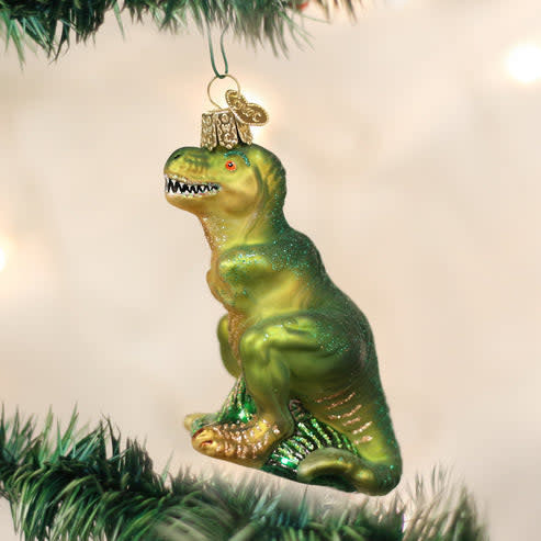 Black T-rex dinosaur ornament with textured scales on a gold stand.