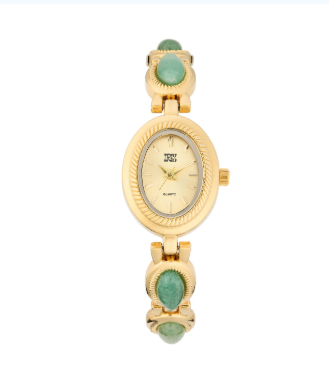 Oval goldtone watch with an etched bezel and green gem-inlaid bracelet links.