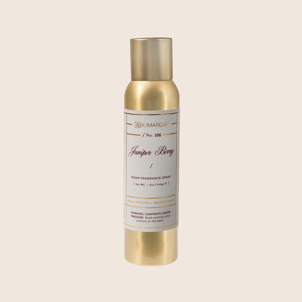 Aerosol room spray bottle with a white label featuring juniper berry imagery.