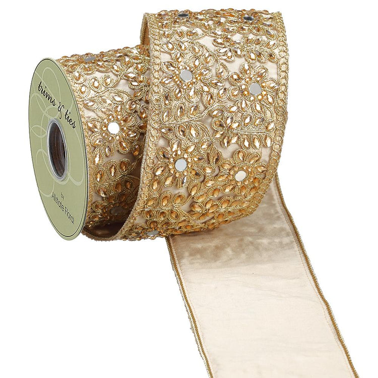 4 inch wide gold jeweled trim ribbon with floral embroidery and mirror accents on a spool.