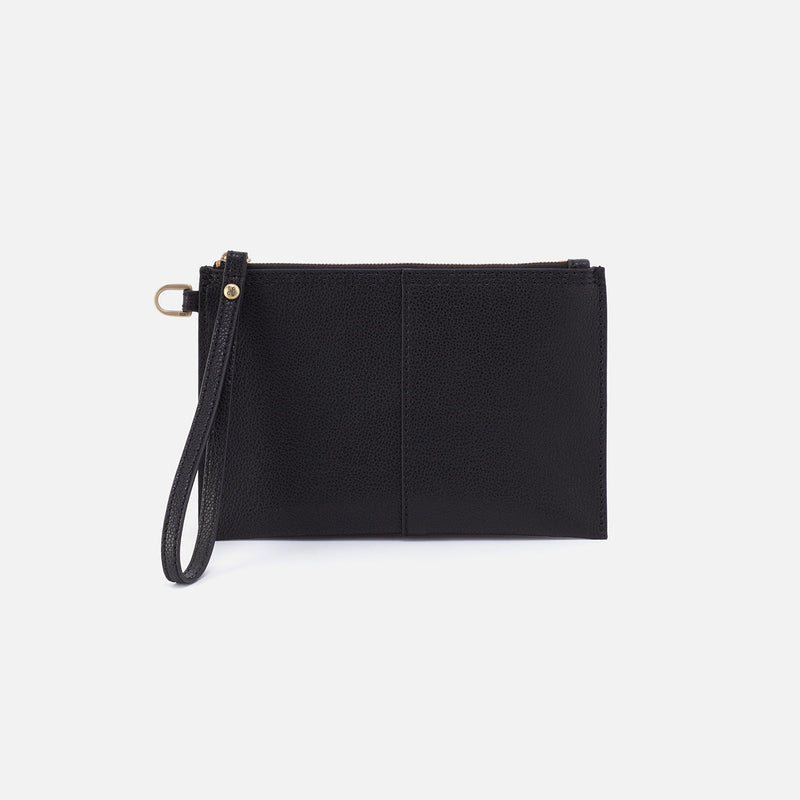 Vida small pouch in solid leather with coconut shell interior, brushed antique brass hardware, and a zip closure.