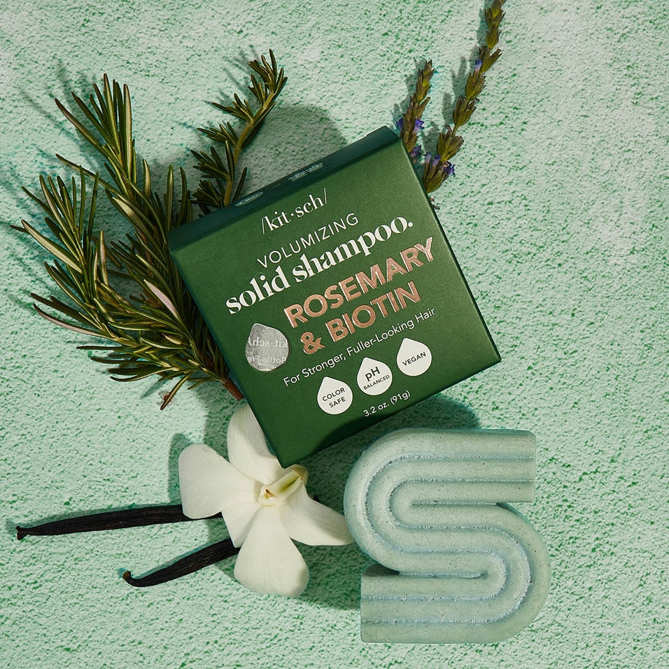 Kitsch Rosemary & Biotin Volumizing Solid Shampoo bar and box with rosemary and vanilla accents.