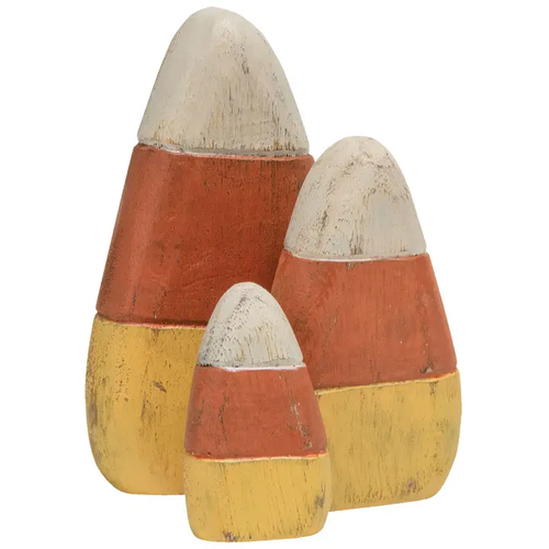 Three freestanding wooden candy corn decorations in distressed white, orange, and yellow painted finish.