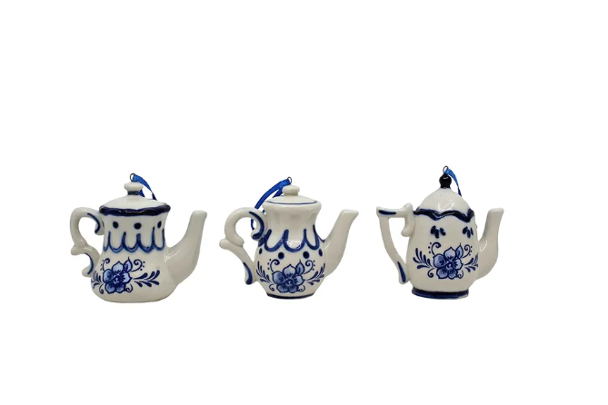 Blue and white Delft teapot ornament hanging from a deep blue ribbon.