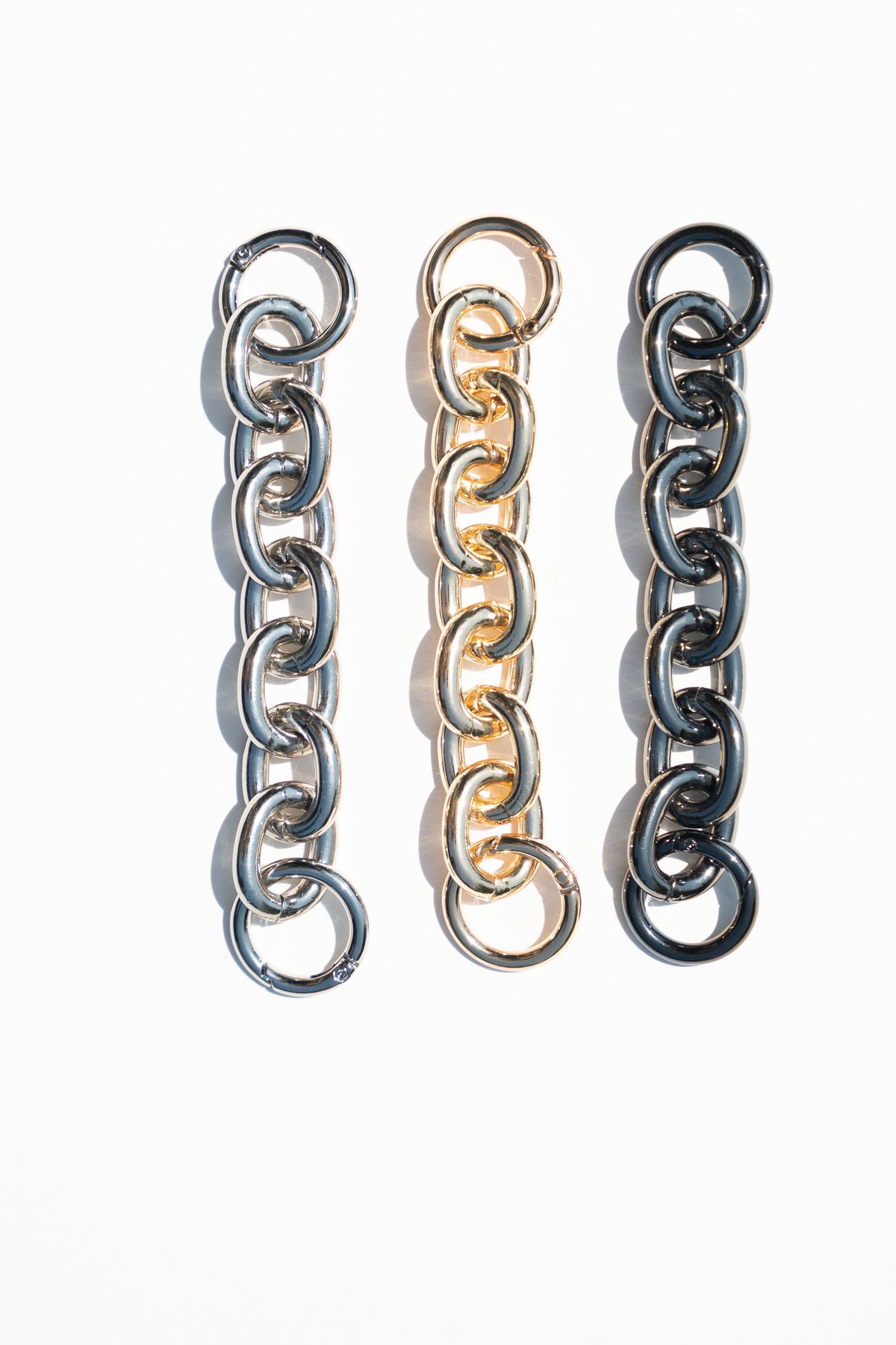 6-inch polished aluminum extender chain with removable spring rings.