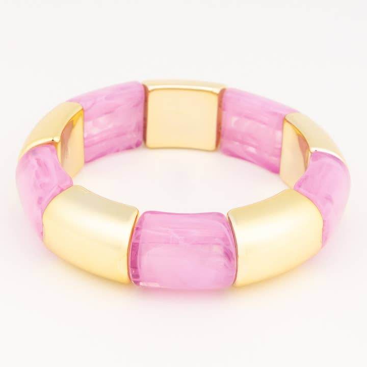 Audrey Orchid Bracelet featuring alternating gold-tone and marbled pink resin rectangular beads.