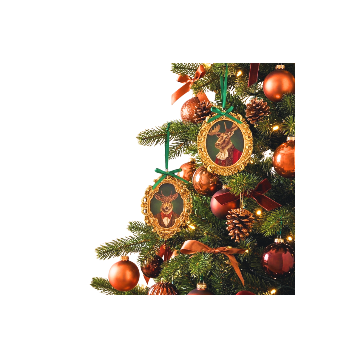 Ornate gold-framed deer and moose bust ornaments hanging on a decorated Christmas tree.