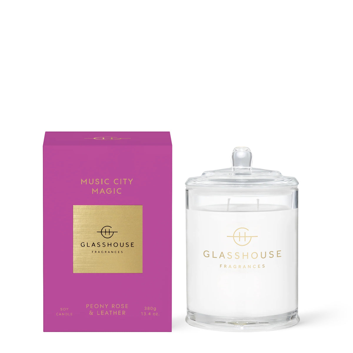 Music City Magic candle in a clear glass jar with soy wax wicks.