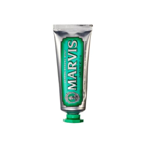 Tube of Marvis Classic Strong Mint toothpaste with white packaging and green branding.