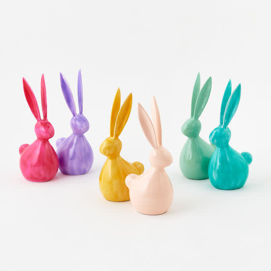 Six medium-sized metal bunny figurines in vibrant pink, purple, yellow, peach, and teal colors.