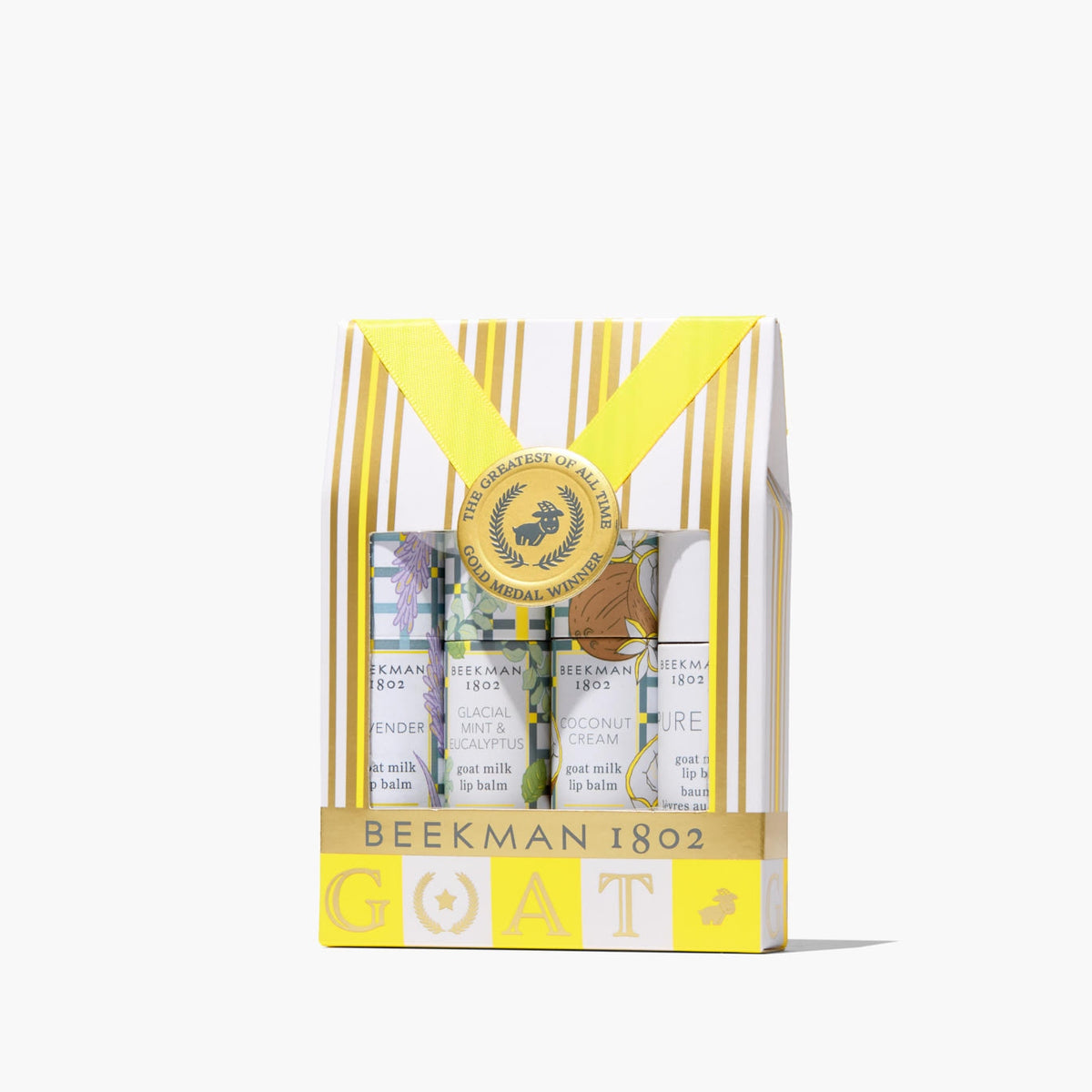 Gift set containing four lip balms in Glacial Mint, Eucalyptus, Lavender, and Coconut Cream scents.