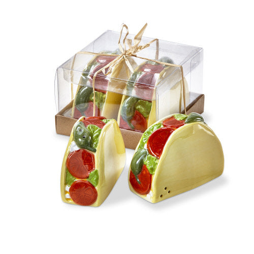 Earthenware salt and pepper shakers with a taco shell shape featuring hand-painted green lettuce details.