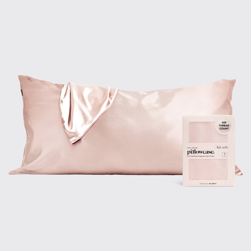 Satin pillowcase in a soft neutral tone with smooth texture.
