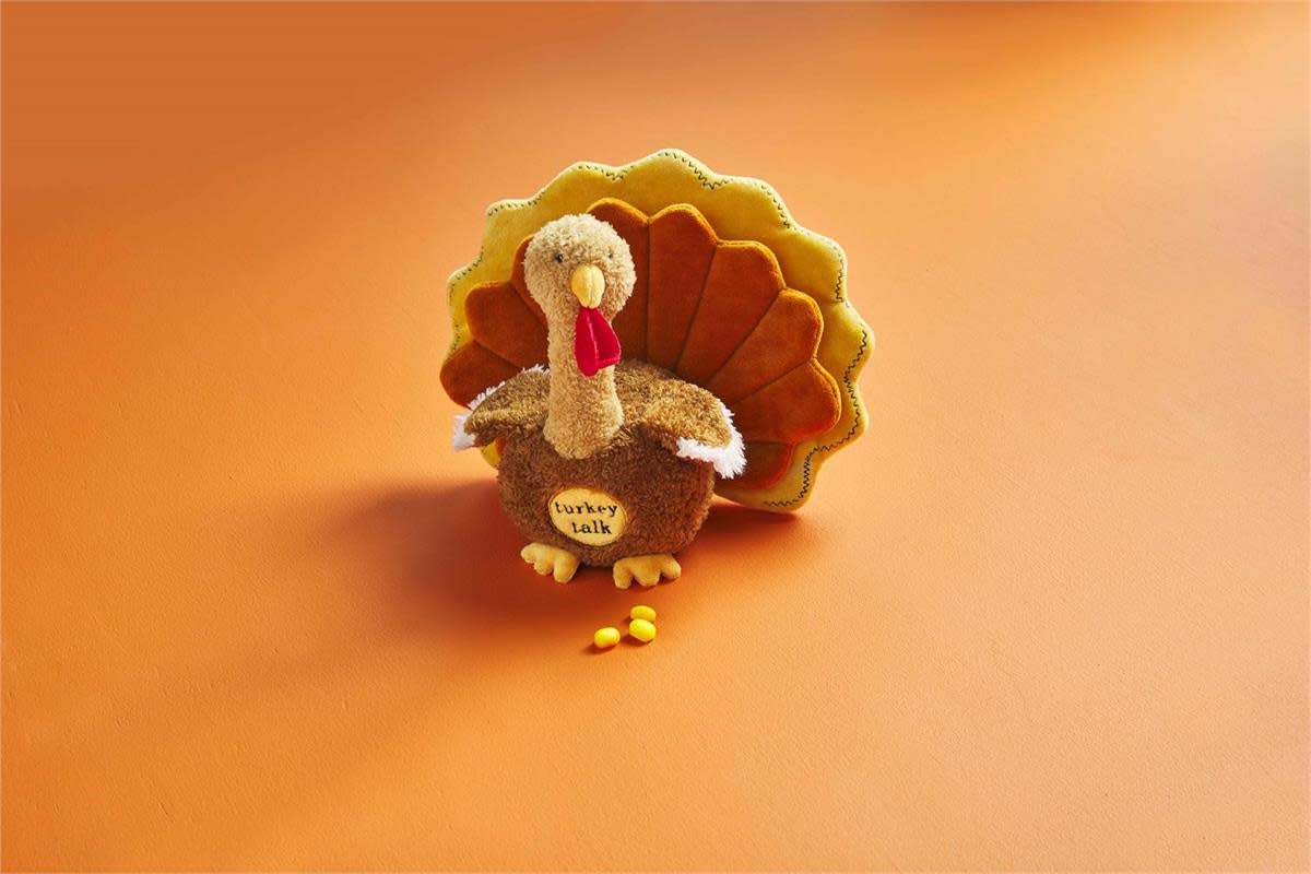 Soft brown polyester plush turkey with chenille texture feathers.