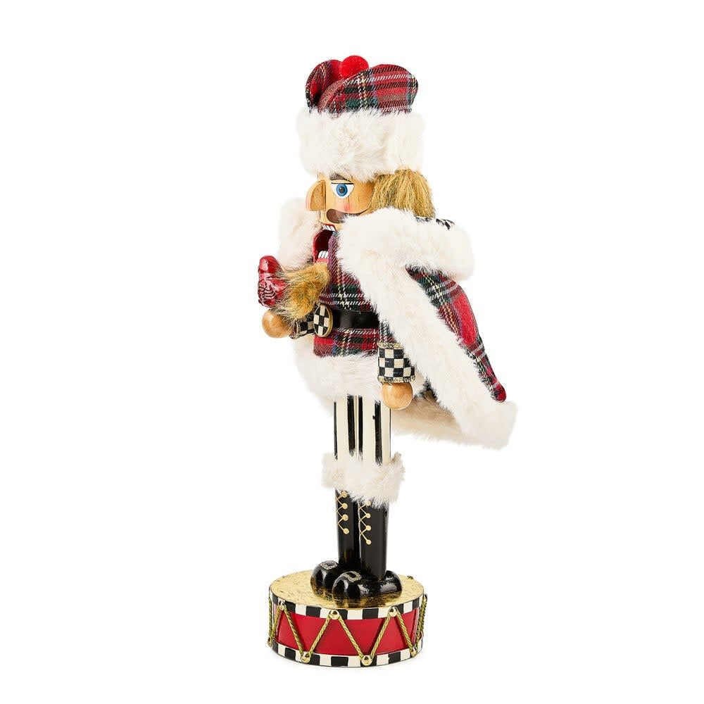 Wooden tartan nutcracker with cardinal bird head on a standing soldier silhouette.