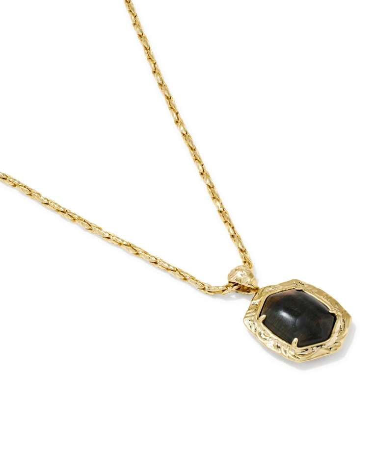 Tiger Striped Daphne Small Long Pendant Gold Necklace with a dark stone and gold chain.
