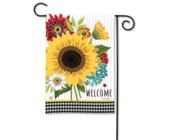 Garden flag with sunflowers, red and blue flowers, and the word WELCOME on a white dotted background with a black gingham border.
