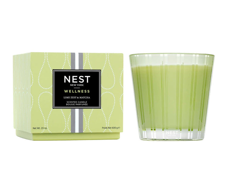 Nest Lime Zest & Matcha 3-Wick Candle in a green glass vessel next to its patterned box.