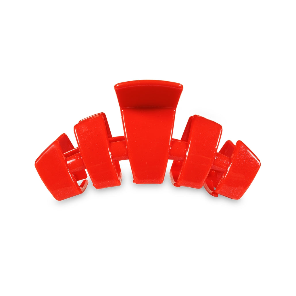 Medium-sized classic hair clip in a neutral tone with a smooth rectangular shape.