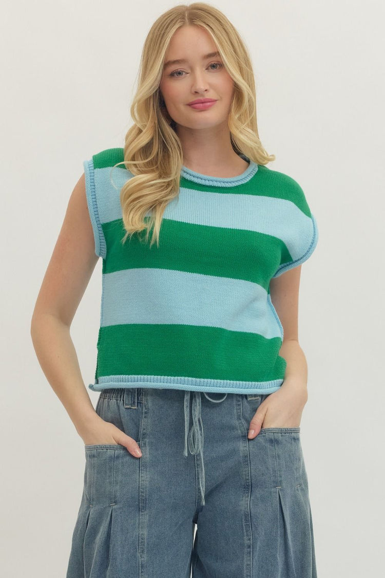 Woman wearing the Kathleen Striped Cap Sleeve Top in green and light blue with denim pants.