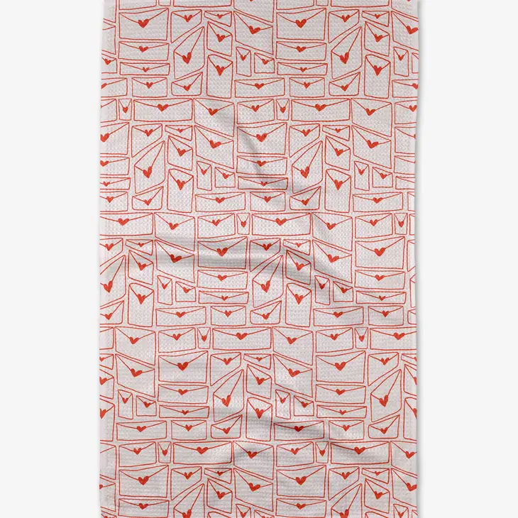 Recycled polyester waffle weave kitchen tea towel with single-sided geometric print in neutral tones.