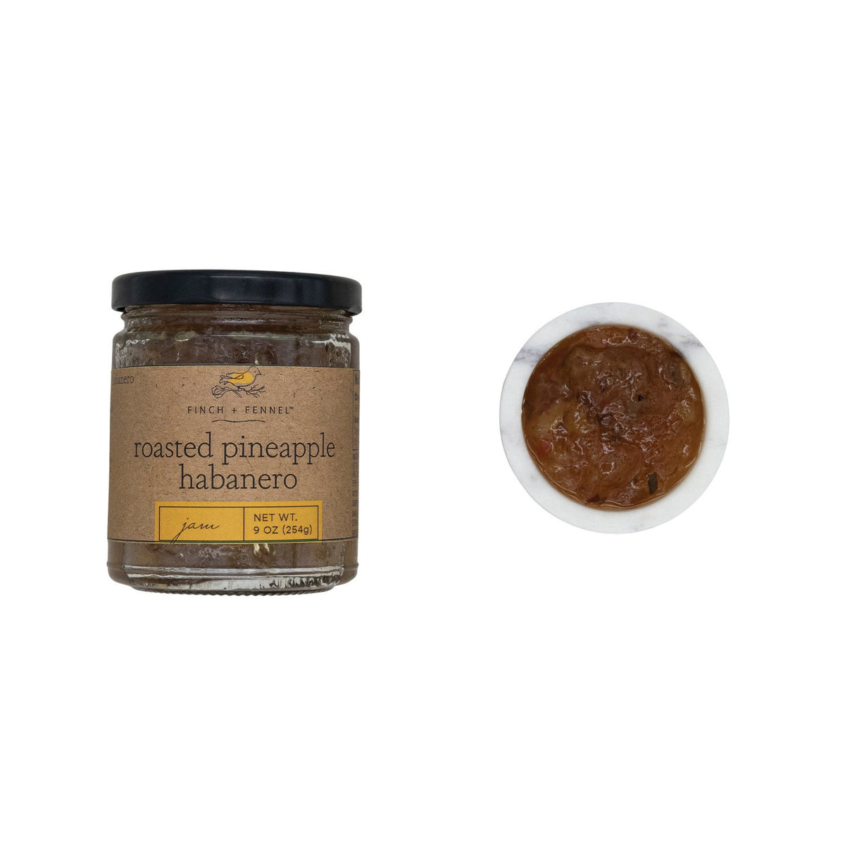 A 9 oz jar of Finch + Fennel Roasted Pineapple Habanero Jam next to a small bowl of the jam.