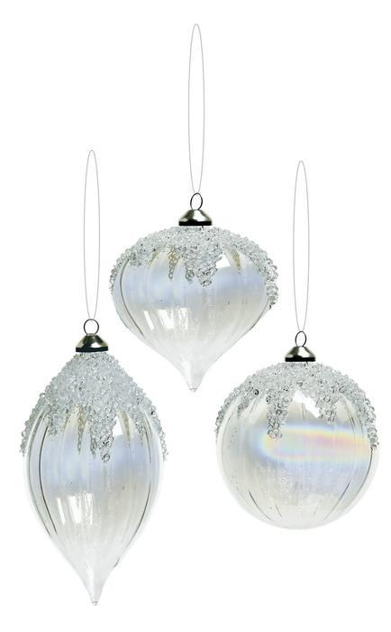 Three clear iridescent swirl glass ornaments with beaded snow and ice caps on top.
