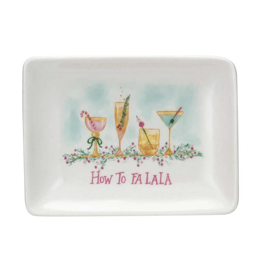 Stoneware dish featuring four holiday cocktails and the pink text "How To FA LA LA".
