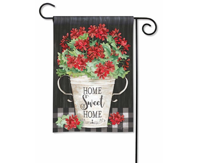 Garden flag with red flowers in a bucket that says "Home Sweet Home" on a black and white buffalo check background.