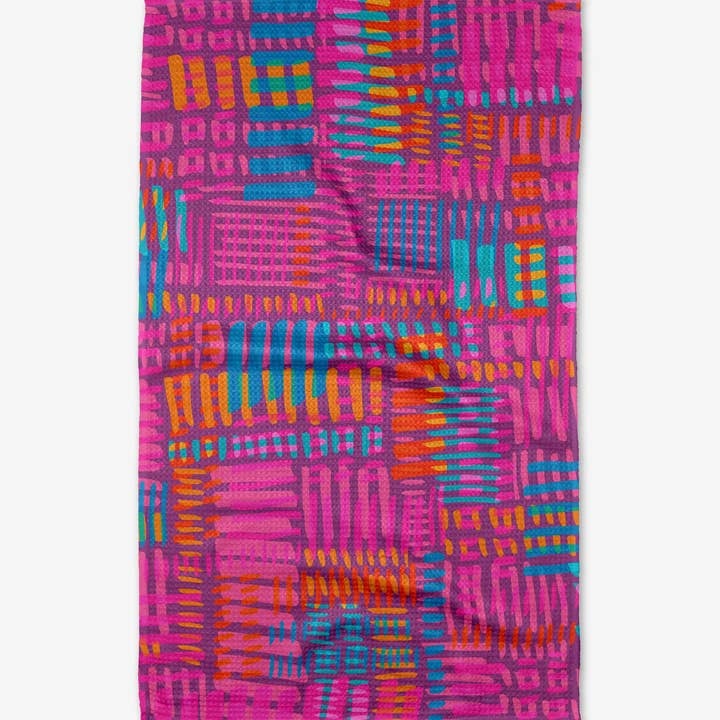 Recycled polyester waffle weave tea towel with single-sided positive vibrations print