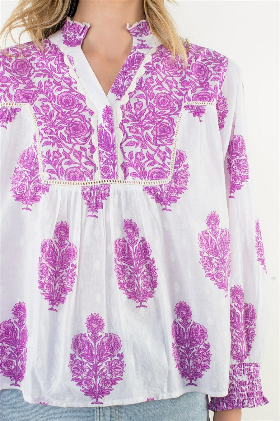 Amy Long Sleeve Flower Print Top in white with purple floral patterns and a split neckline.