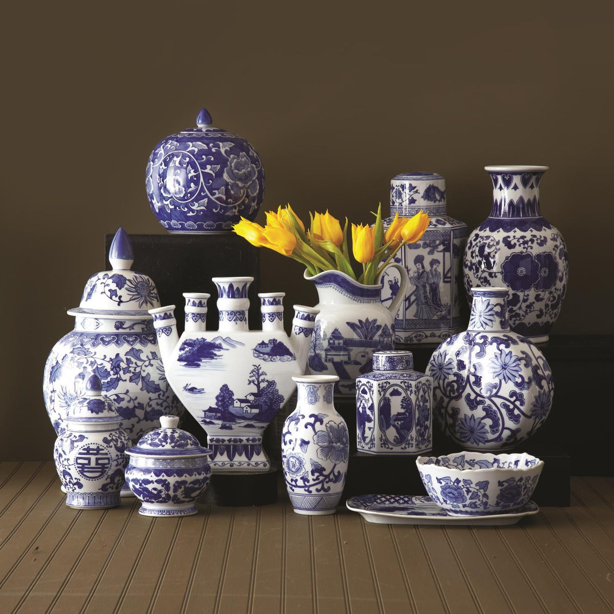 Collection of blue and white Canton ceramic home decor items in traditional shapes and patterns.