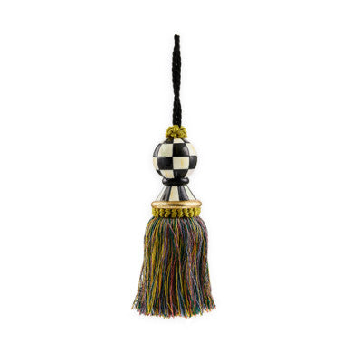 Hand-painted resin check tassel with fabric skirt in black and white pattern.