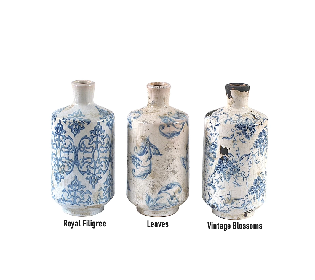 Round terracotta vase with antique transferware patterns in earthy tones.