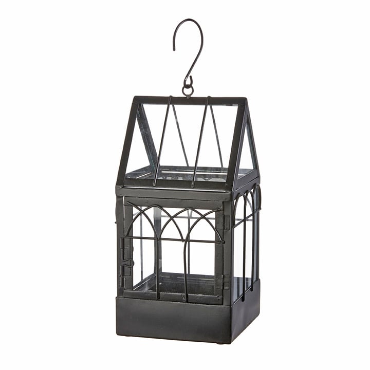 Black metal terrarium with a glass house-shaped frame and a top hanging hook.
